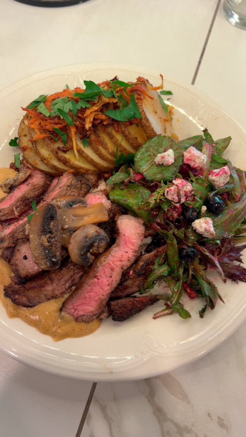 Black Angus NY Strip — plated with hasselback potato and mushrooms